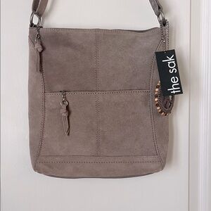 The Sak Taupe Suede Crossbody with Peace Charm